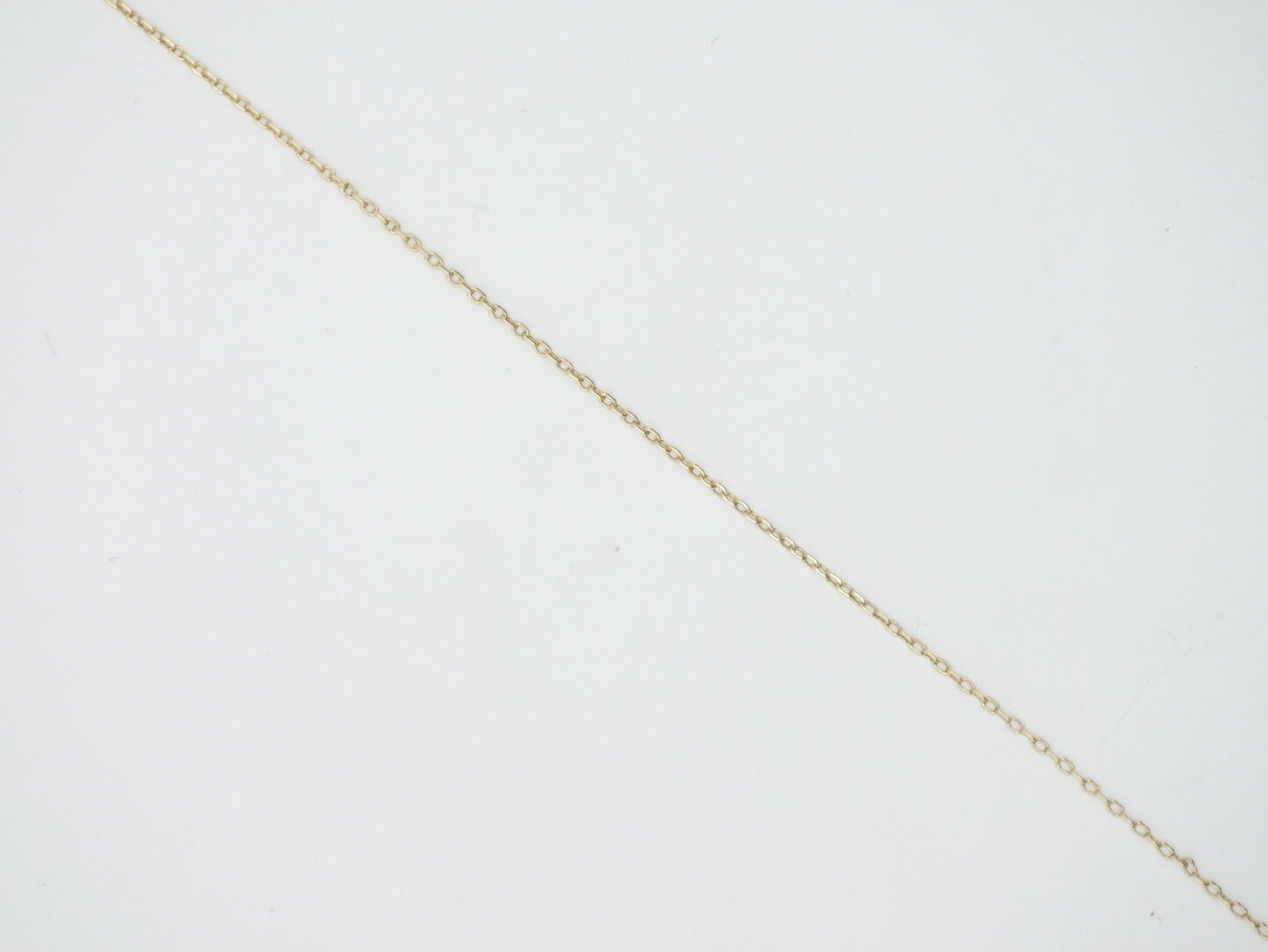 Null 20th CENTURY 

Gold chain 750/1000e, lobster clasp 

Weight : 2,95 g. 

L. &hellip;