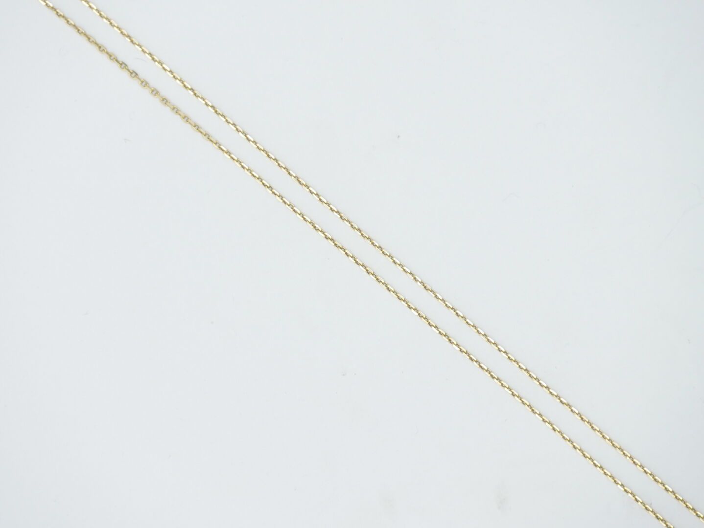 Null 20th CENTURY 

Gold chain 750/1000e, lobster clasp 

Weight : 2,85 g. 

L. &hellip;
