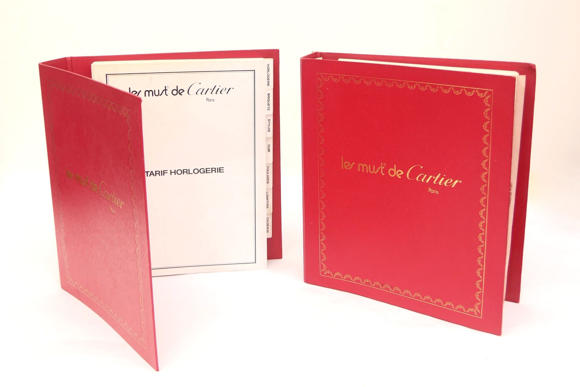 Null CARTIER 

The Must 

Set of two commercial binders on pens, lighters, acces&hellip;