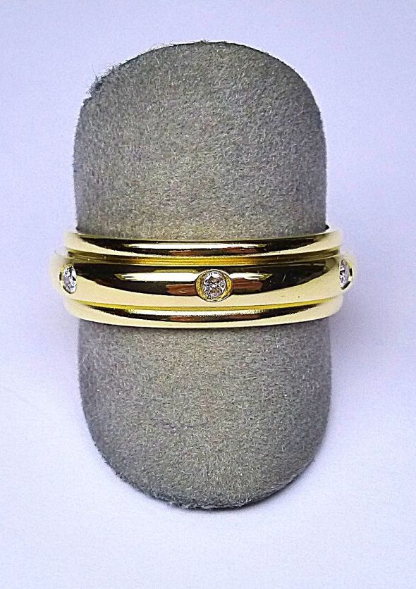 Null 伯爵式 "黄金戒指，镶嵌六颗现代切割圆钻，品质为G/VS。

TDD 54

重量：6.85克