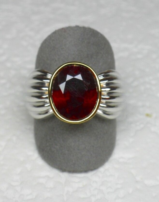 Null Ring in two-tone gold holding in closed setting a ruby of beautiful color f&hellip;