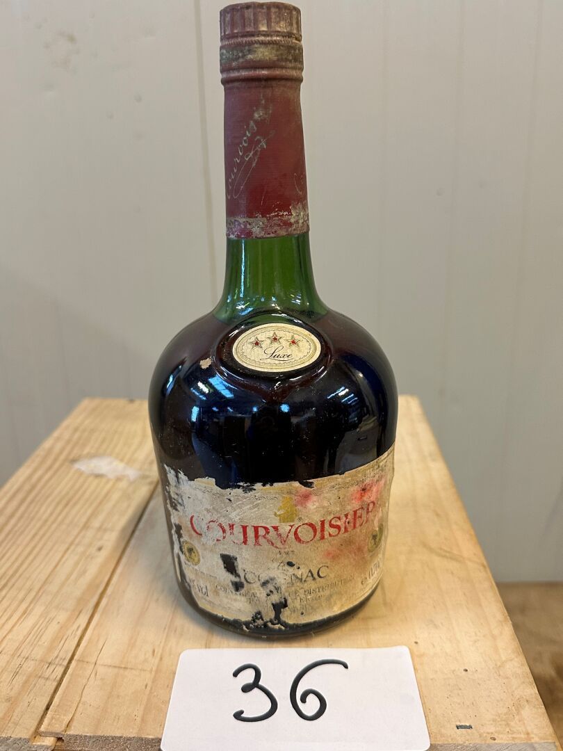 Null 1 blle Cognac Courvoisier (Etiquette abîmée - Niveau bas)