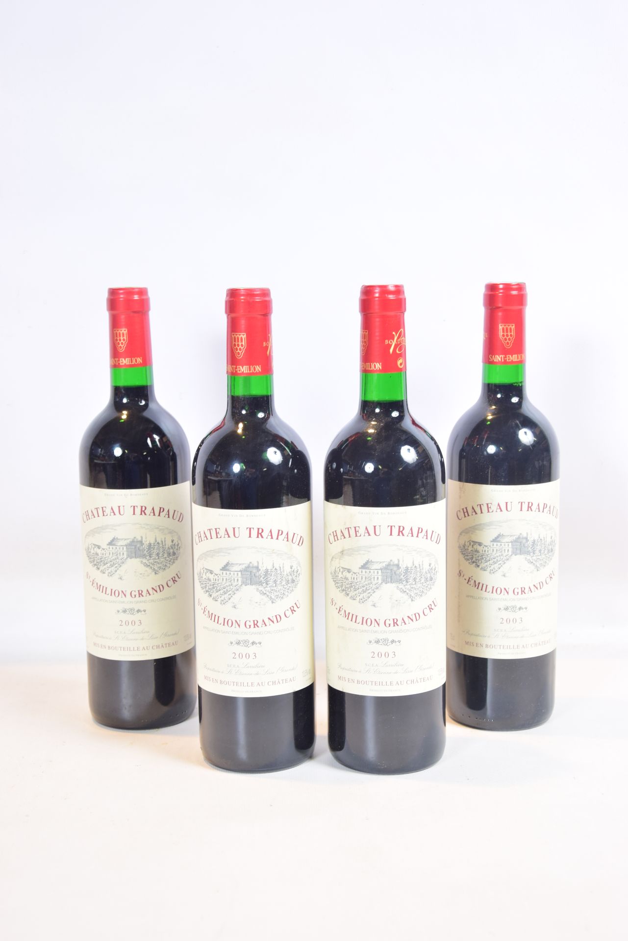 Null 4 Blles CH. TRAPAUD St Emilion GC 2003

	And. A little stained. N: 3 half n&hellip;