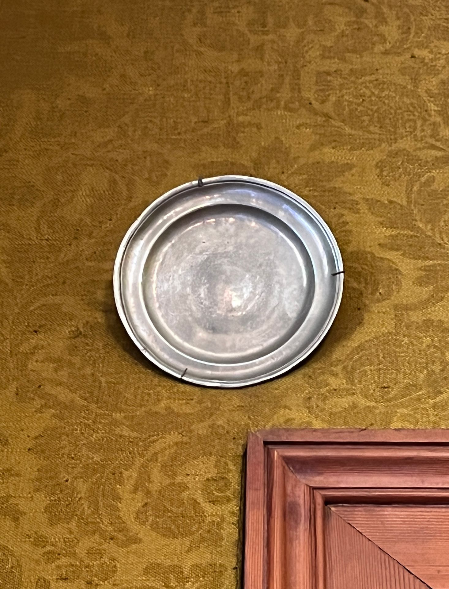 Null 90. Suite of three pewter plates, on the wall

End of the XVIIIth century