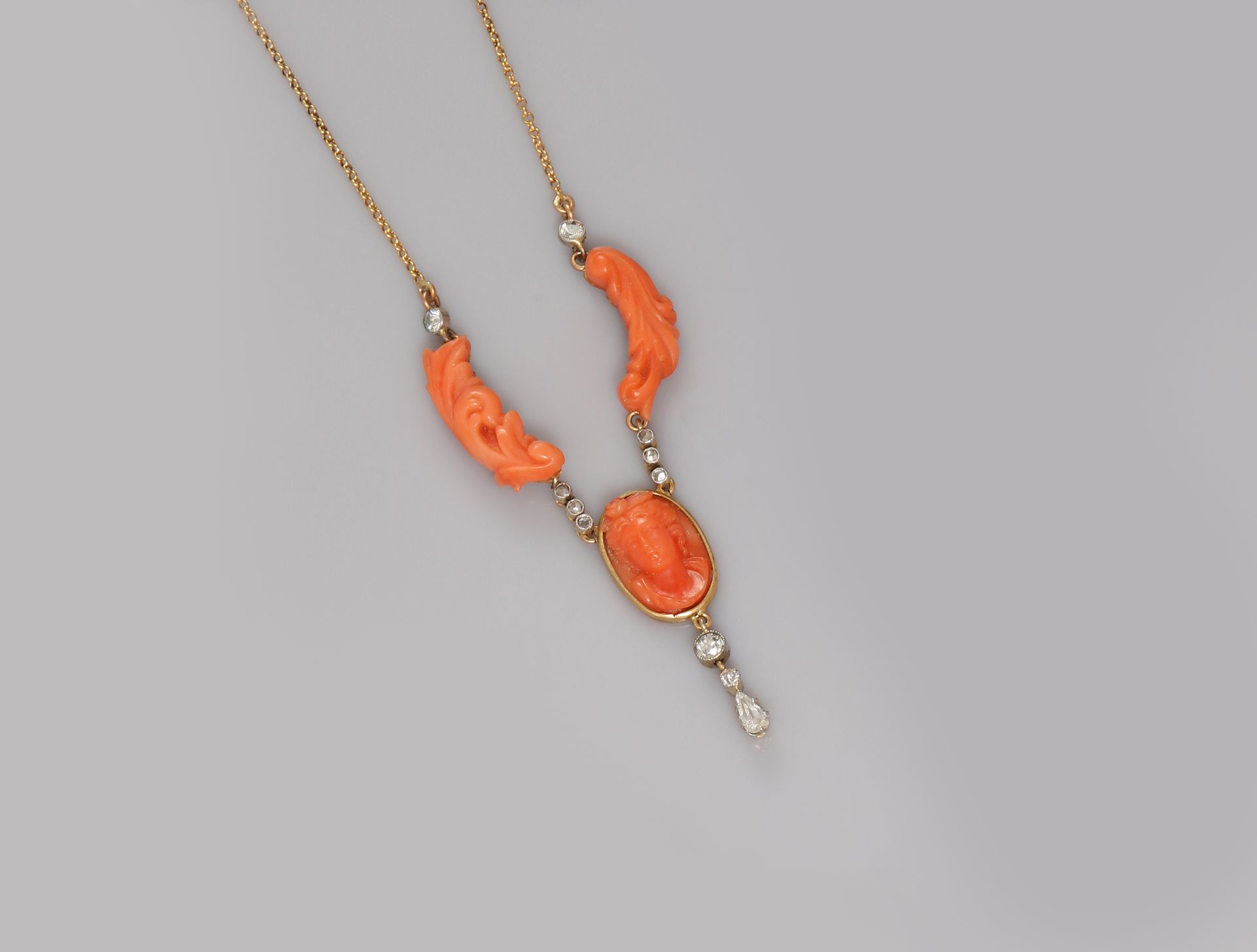Null Yellow gold necklace, 750 MM, centered on two elements of carved coral and &hellip;