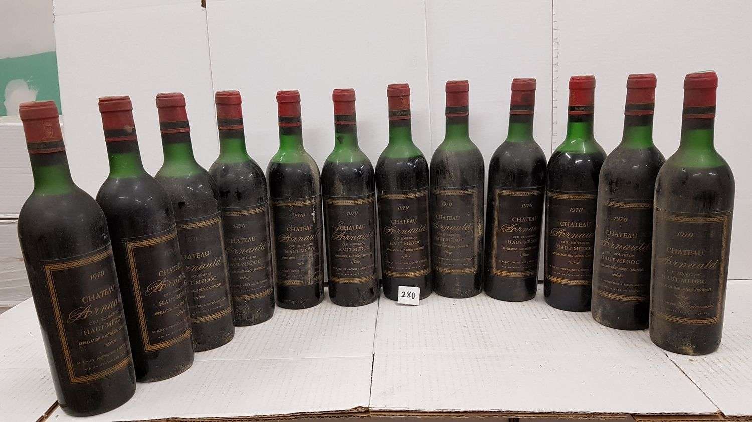 Null 12 bottles Château ARNAULD 1970 Haut Médoc all high shoulders. Dusty labels&hellip;