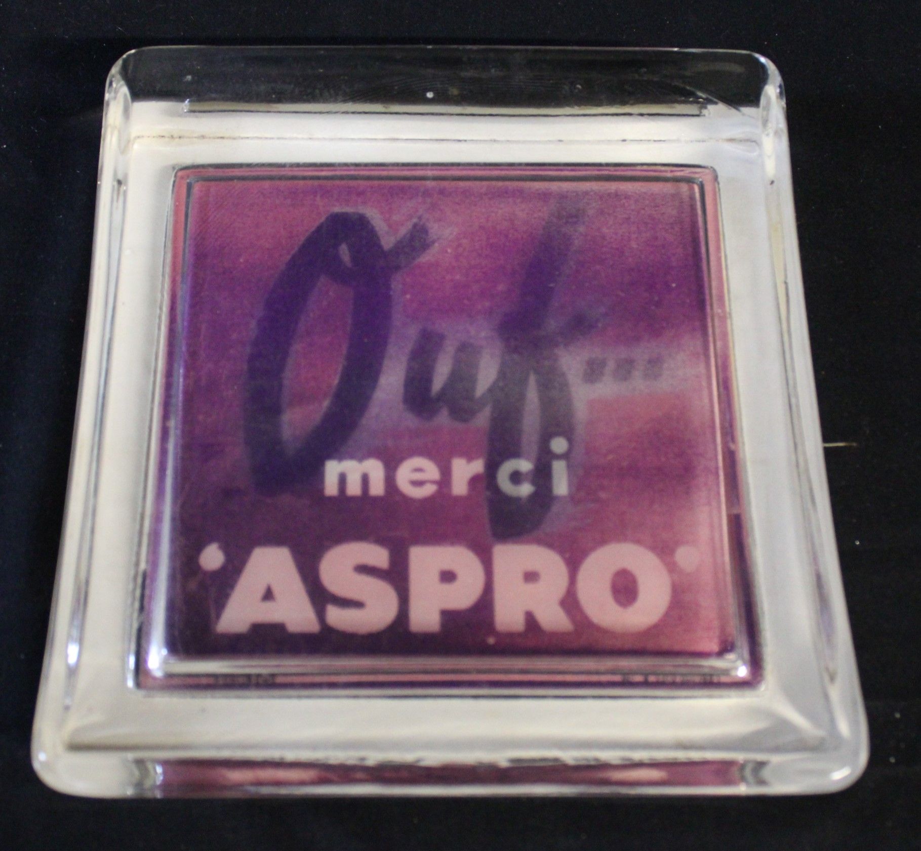 Null 
Bolsillo cuadrado "OUF MERCI ASPRO", en vidrio, 17cm