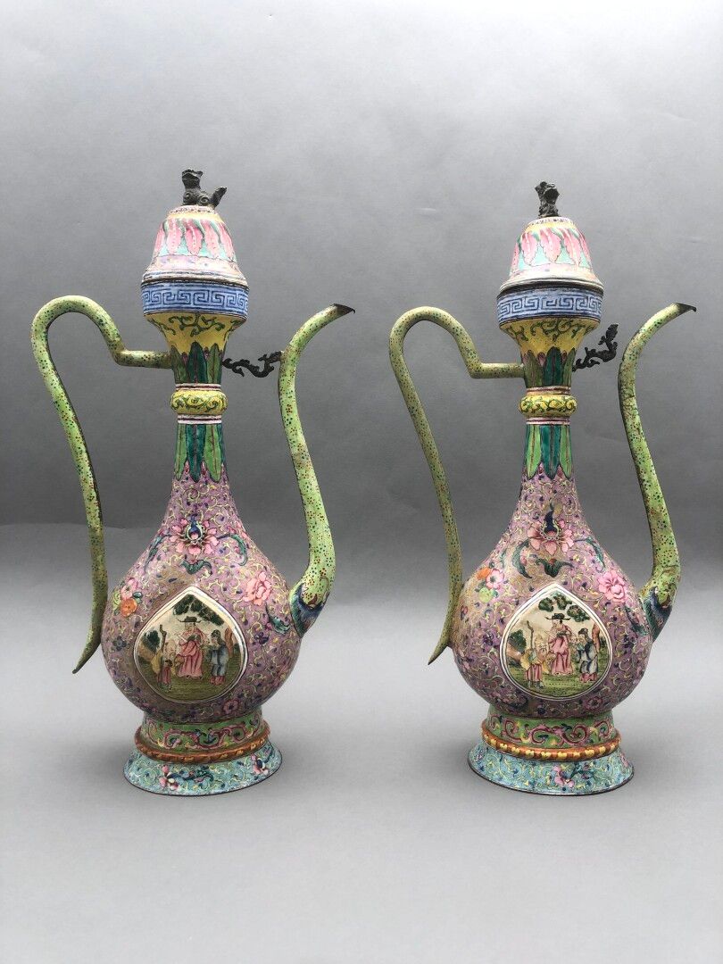 Null A pair of enamelled copper ewers and wine pourers painted in polychrome wit&hellip;