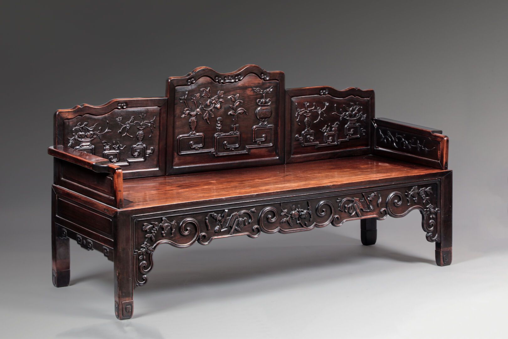 Null Bench in exotic wood richly carved with flowering vases, the belt decorated&hellip;