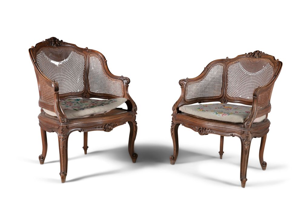 Null A PAIR OF FRENCH CARVED FRUITWOOD FRAMED BERGERE ARMCHAIRS, with cane backs&hellip;