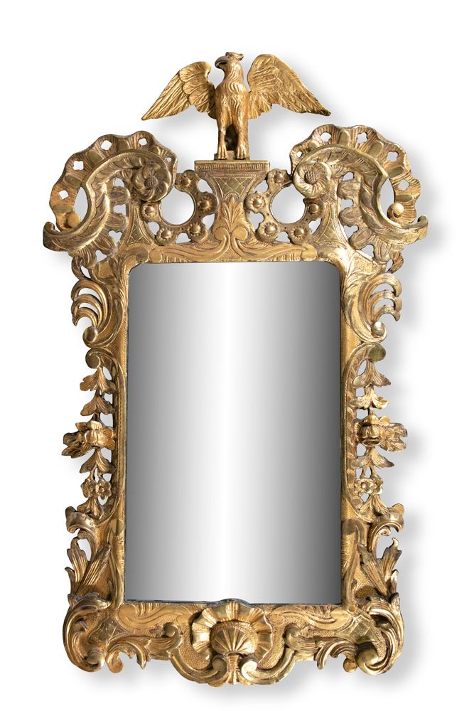 Null AN IRISH CARVED GILTWOOD MIRROR, C.1740, with scrolled pierced shoulders, f&hellip;