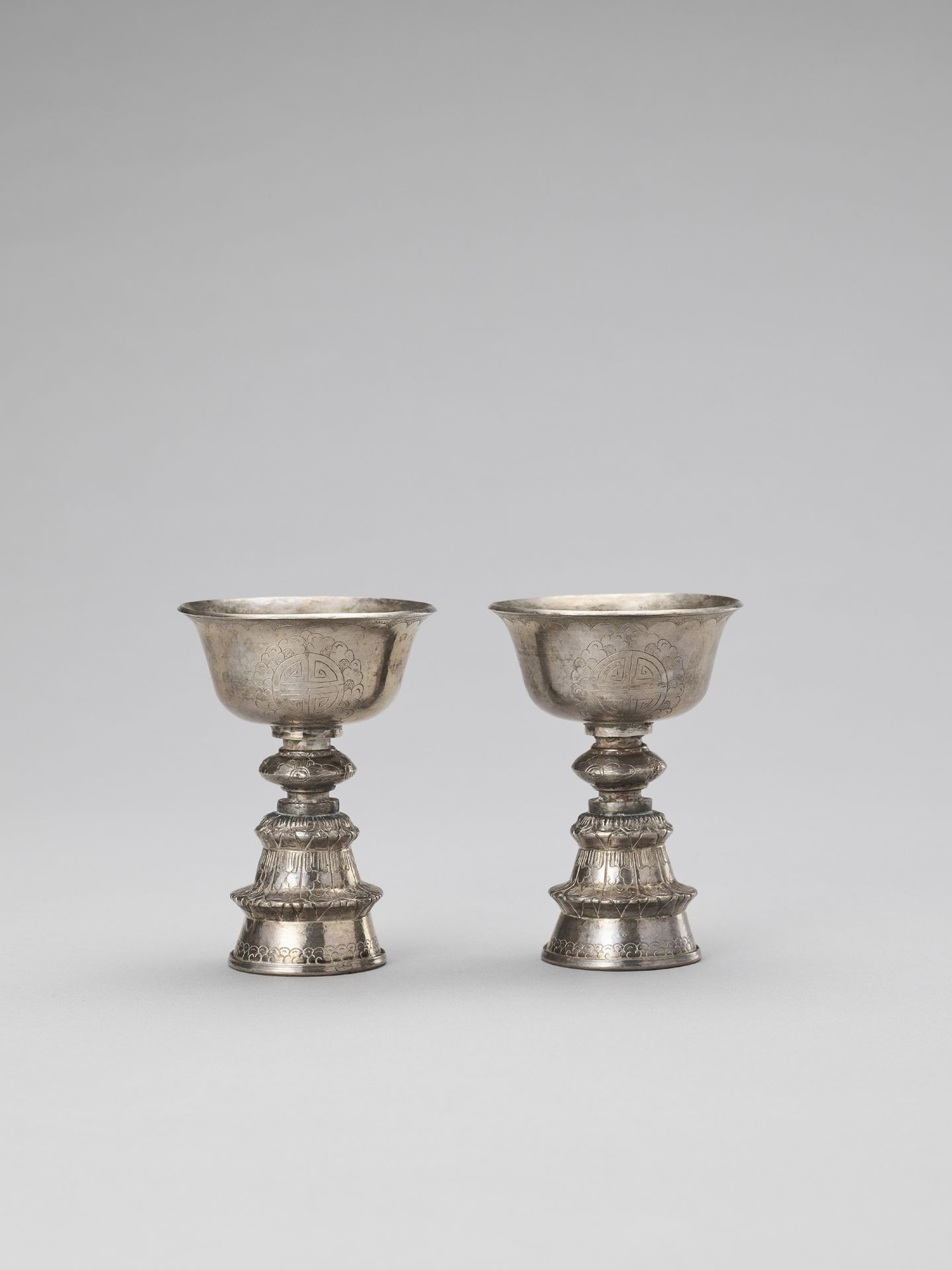 A PAIR OF SINO-TIBETAN BUTTER LAMPS, LATE 19TH CENTURY A PAIR OF SINO-TIBETAN BU&hellip;