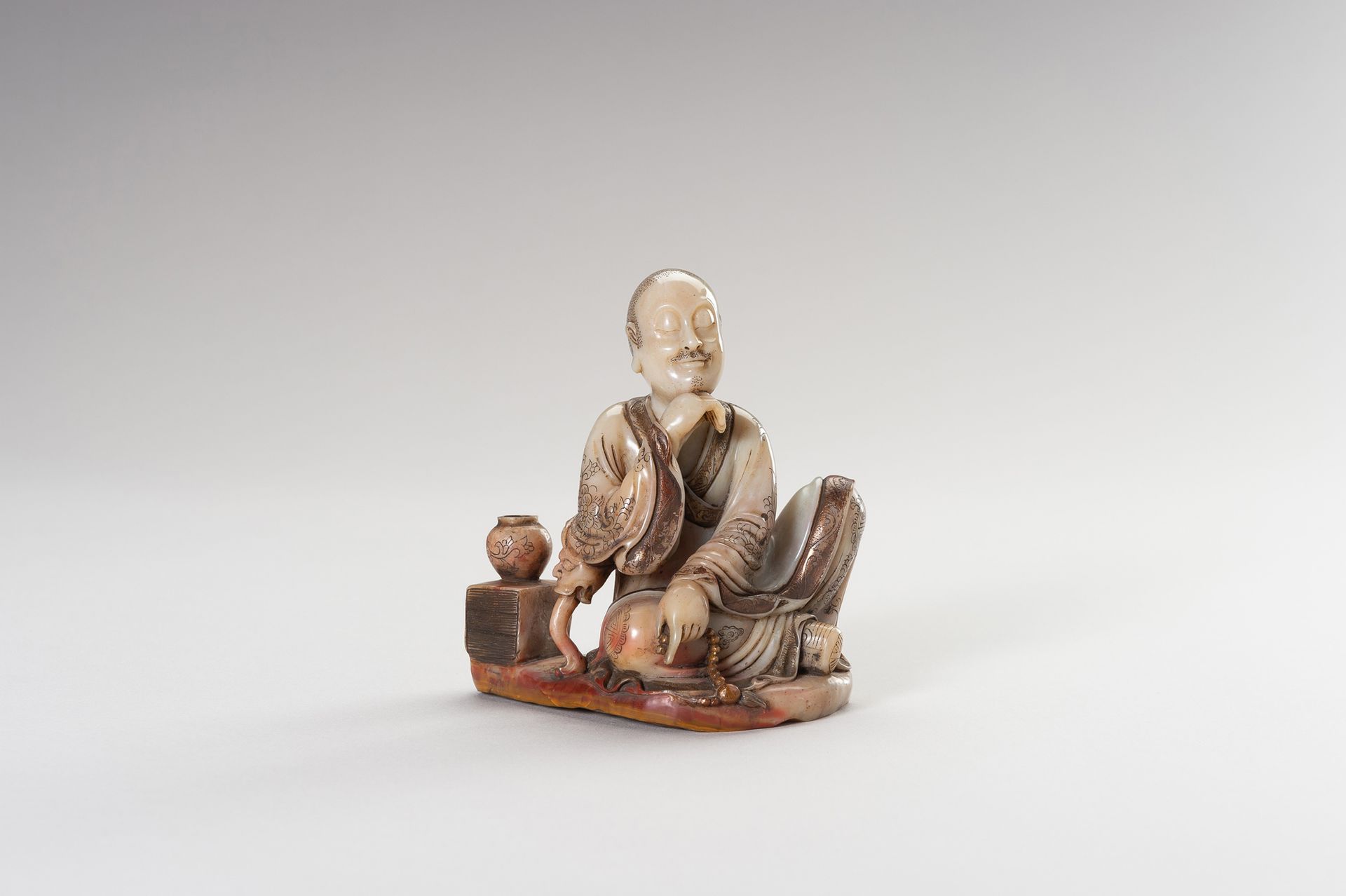 A SOAPSTONE FIGURE OF A LUOHAN A SOAPSTONE FIGURE OF A LUOHAN
China, around 1900&hellip;