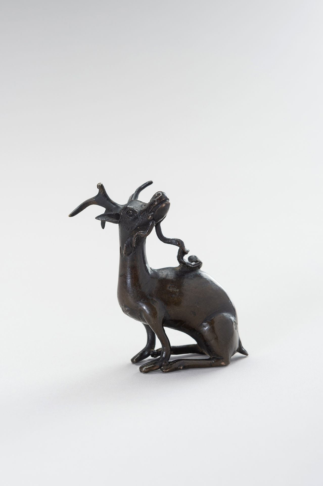 A CHINESE BRONZE WATER DROPPER IN THE SHAPE OF A STAG 中国青铜鹿形滴水壶
中国，明末（1368-1644）&hellip;
