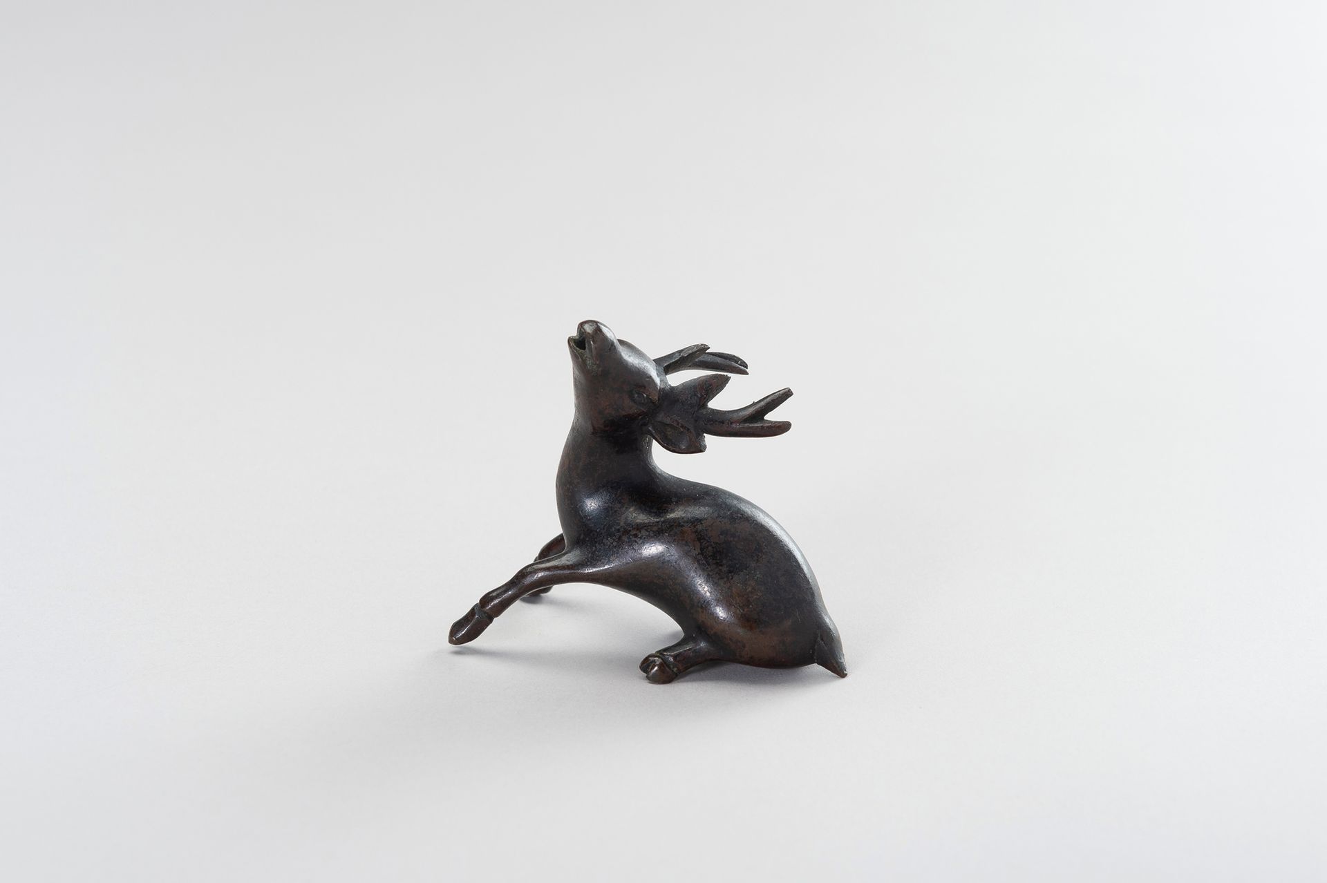 A CHINESE BRONZE FIGURE OF A STAG A CHINESE BRONZE FIGURE OF A STAG
China, late &hellip;