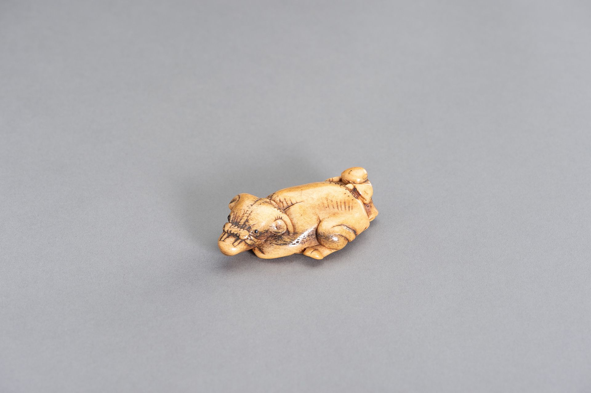 A STAG ANTLER NETSUKE OF AN OX AND OXHERD A STAG ANTLER NETSUKE OF AN OX AND OXH&hellip;