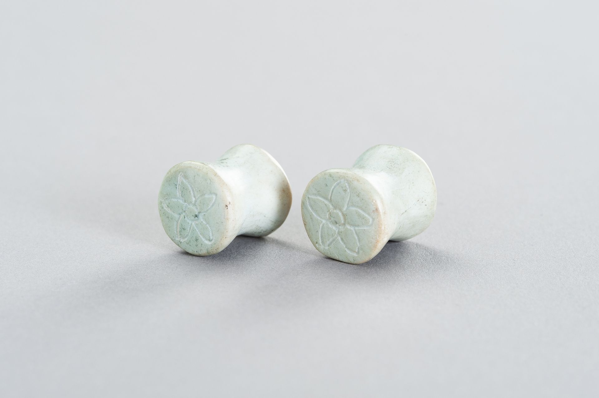 A PAIR OF STONE EARPLUGS A PAIR OF STONE EARPLUGS
Southeast Asia, early 20th cen&hellip;