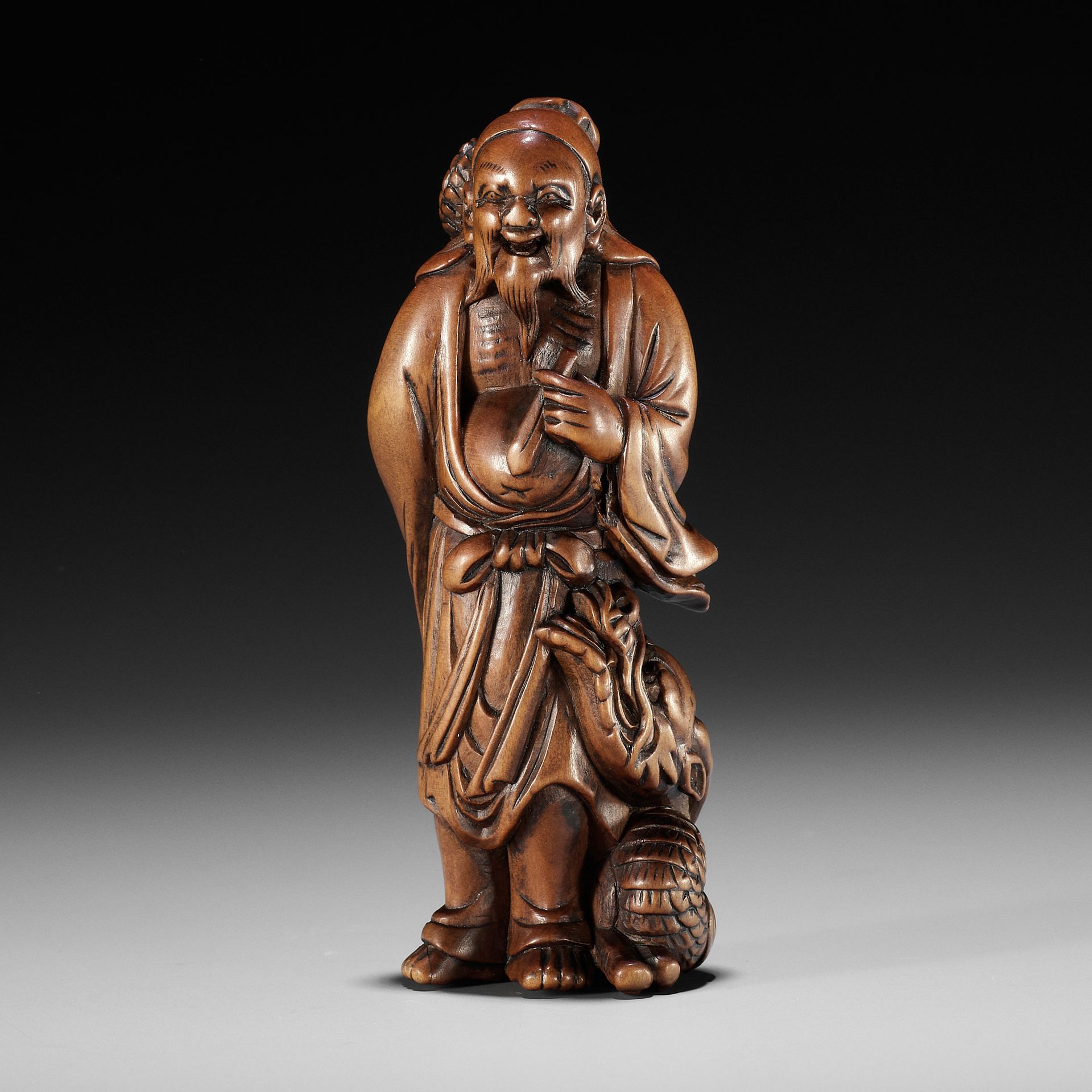 AN EXCEPTIONAL AND RARE WOOD NETSUKE OF RYO TOHIN TAUNTING A DRAGON EXCEPTIONNEL&hellip;