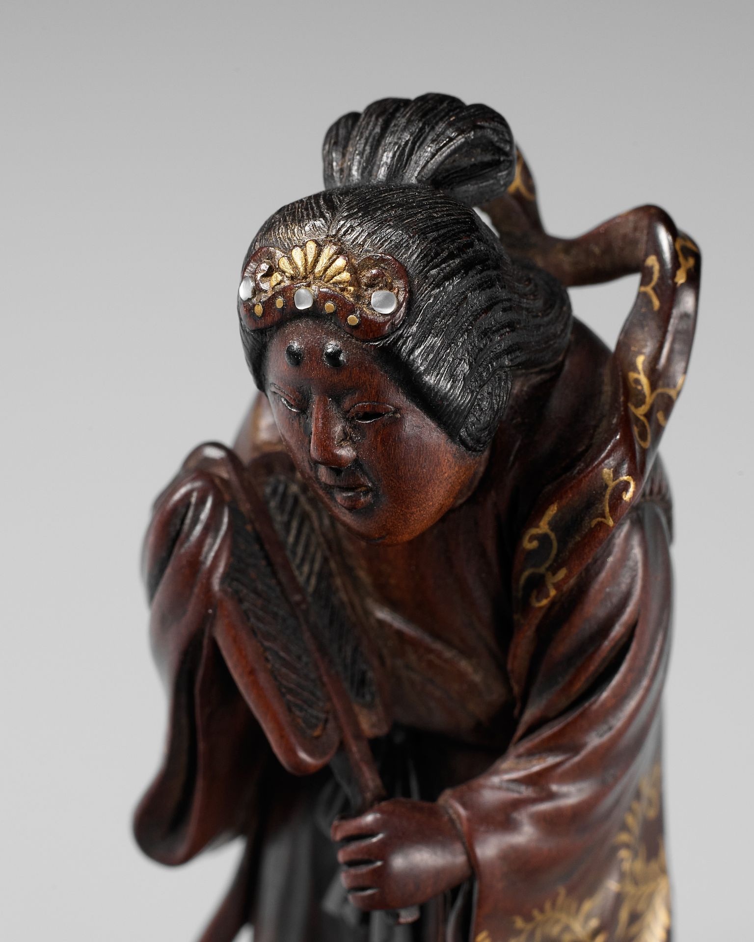 KYOKUSEI: A SUPERB AND LARGE LACQUERED AND INLAID WOOD NETSUKE OF BENTEN KYOKUSE&hellip;