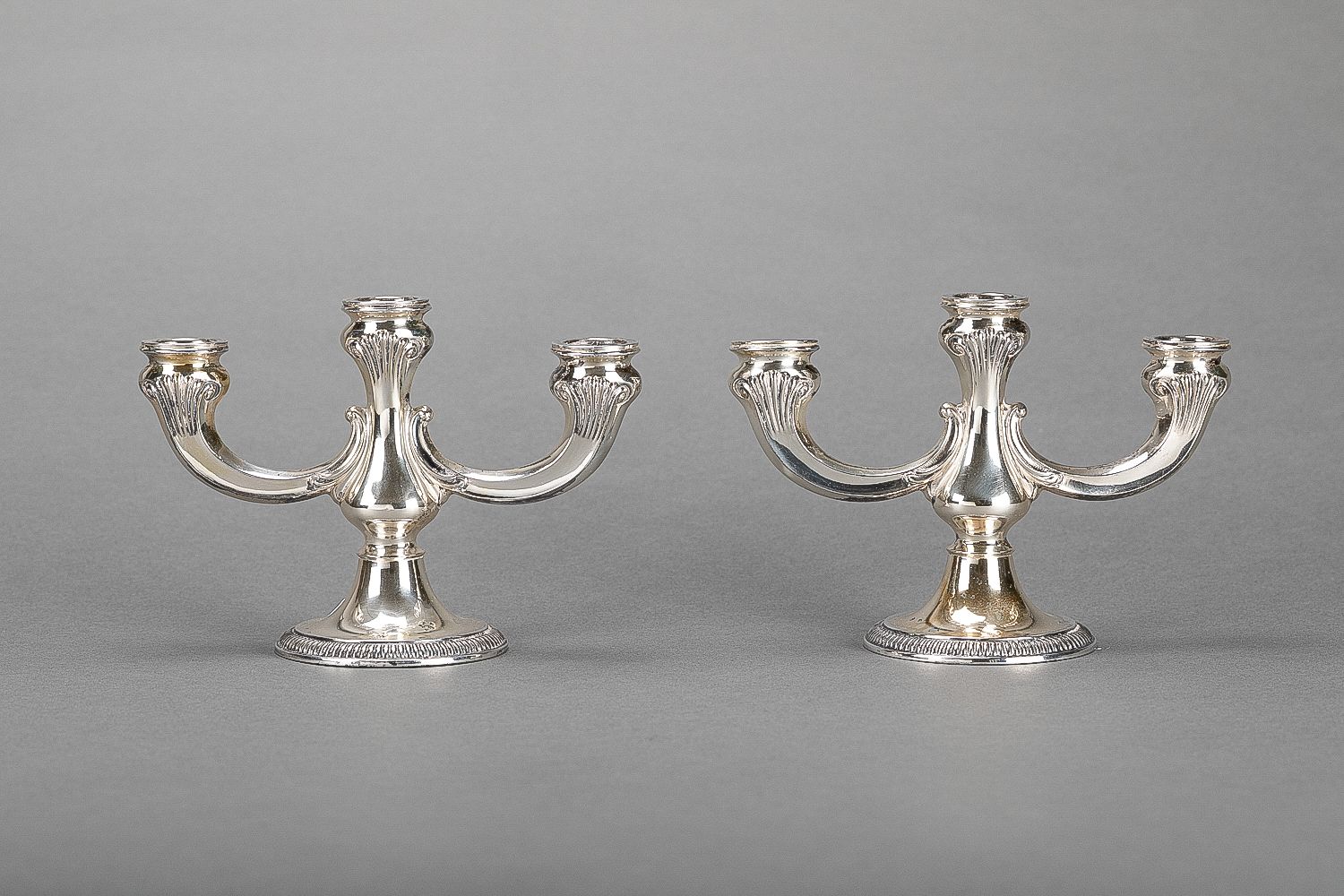 Null Pair of silver candelabra, each with three branches, 925/1000; weight 616g.&hellip;