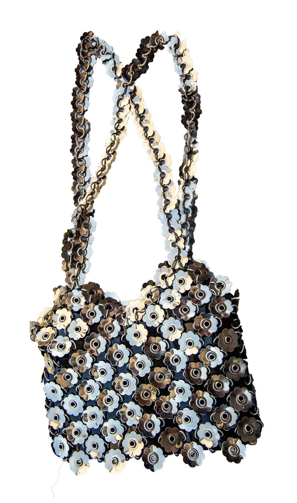 Null 帕科-拉巴纳

花卉金属包



描述。

由抛光钢花形金属盘制成的包。单肩包。标签上写着：PACO RABANNE PARIS 法国制造，内部。全衬&hellip;