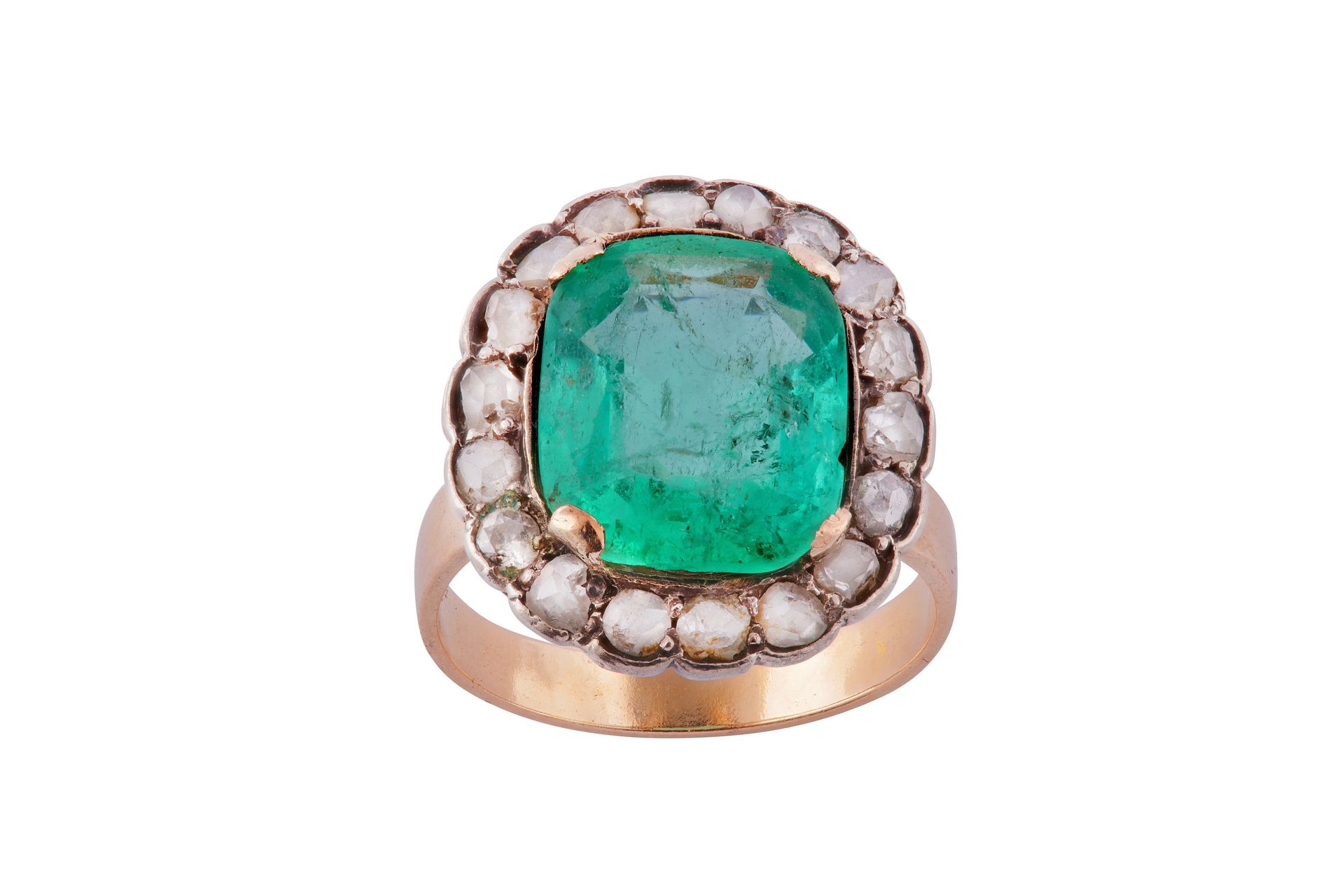 An emerald and diamond cluster ring An emerald and diamond cluster ring The cush&hellip;