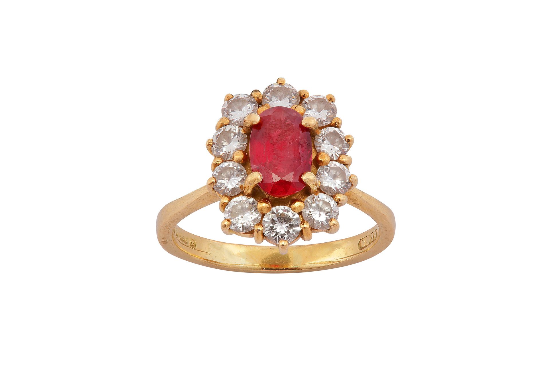 A ruby and diamond cluster ring A ruby and diamond cluster ring The oval cut rub&hellip;