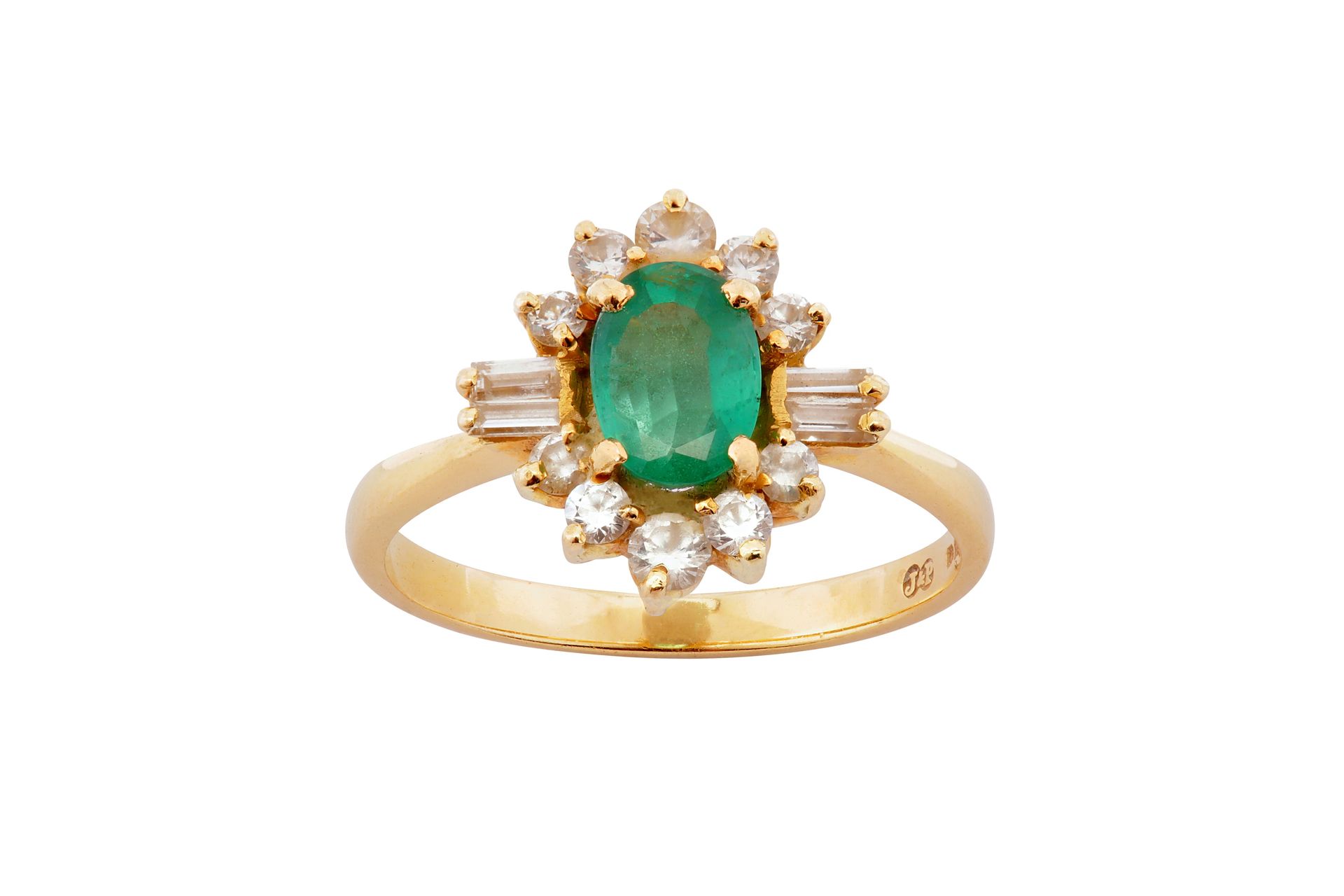 An emerald and diamond cluster ring An emerald and diamond cluster ring The oval&hellip;