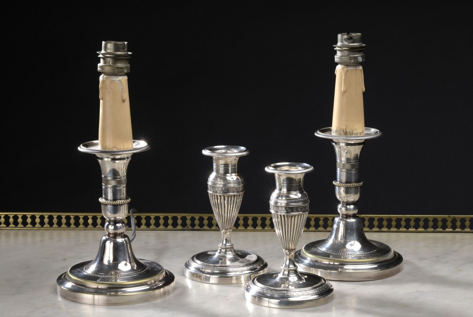 Null Four Directoire style silver plated toilet candlesticks

H. 14 and 12,5 cm