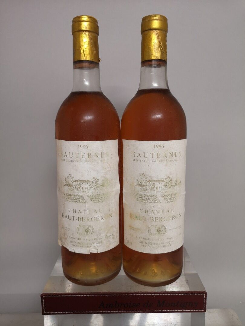 Null 2瓶Chateau HAUT BERGERON - Sauternes 1986 染色标签。水平略低。