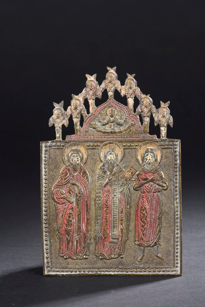 Null 俄罗斯，17-18世纪

一个老信徒和三位圣人的圣像

鎏金青铜，多色珐琅。

H.17 宽11.5厘米