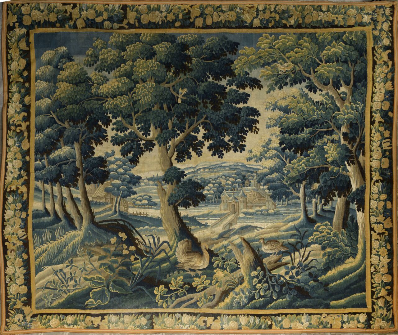 Null 奥布森，17世纪末至18世纪初。

羊毛绿色挂毯上装饰着鸟类和透视的城堡。

边缘有叶子。

事故和修复。

295 x 356 cm