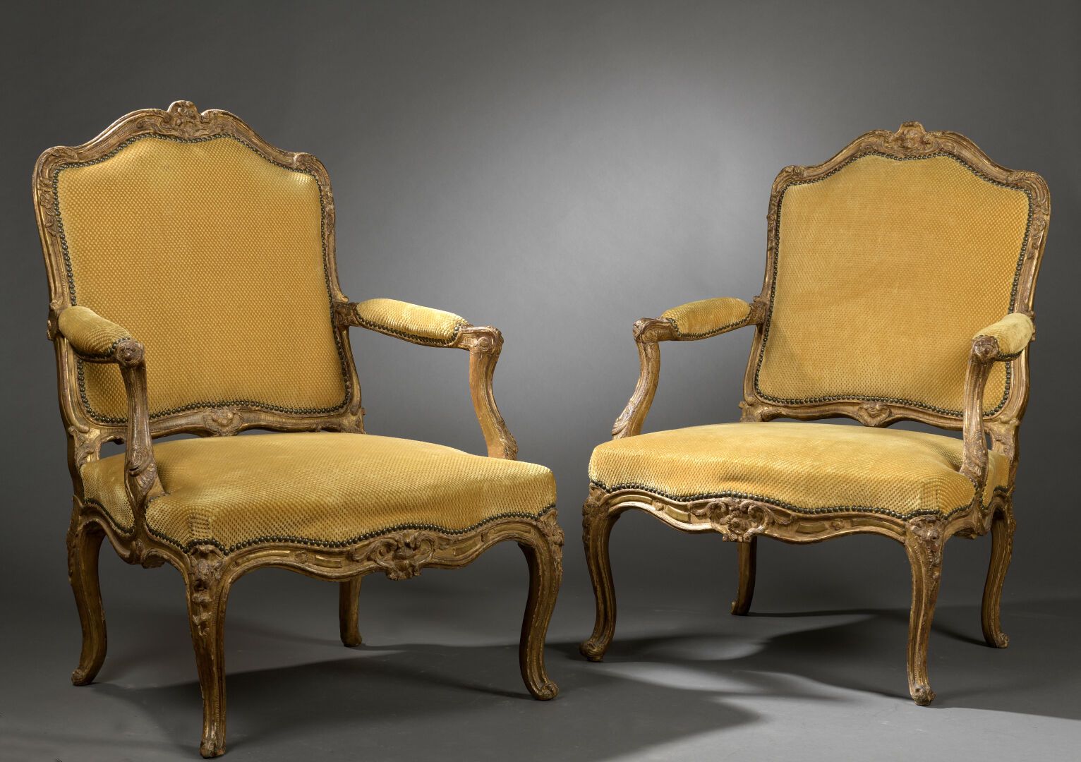 Null 
Pair of large molded wood armchairs, carved and gilded stamped I BOUCAULT &hellip;