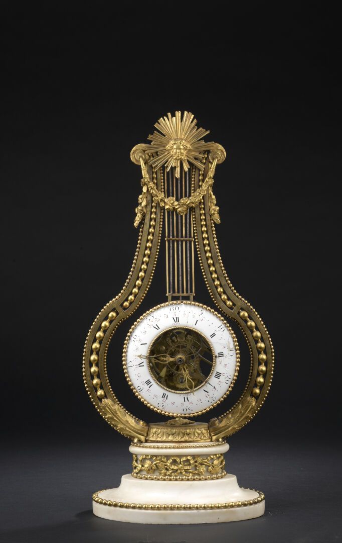 Null Pendule lyre en bronze ciselé et doré, marbre blanc d'époque louis XVI

Le &hellip;