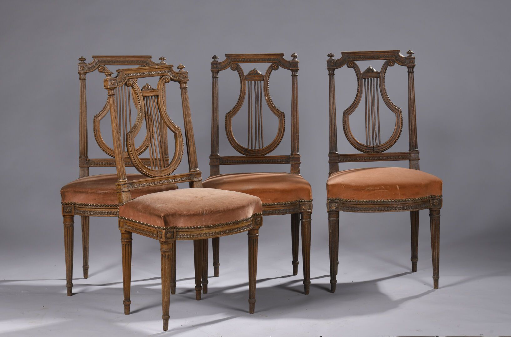 Null SUITE OF FOUR CHAIRS, Louis XVI period, with lyre-shaped back in molded nat&hellip;