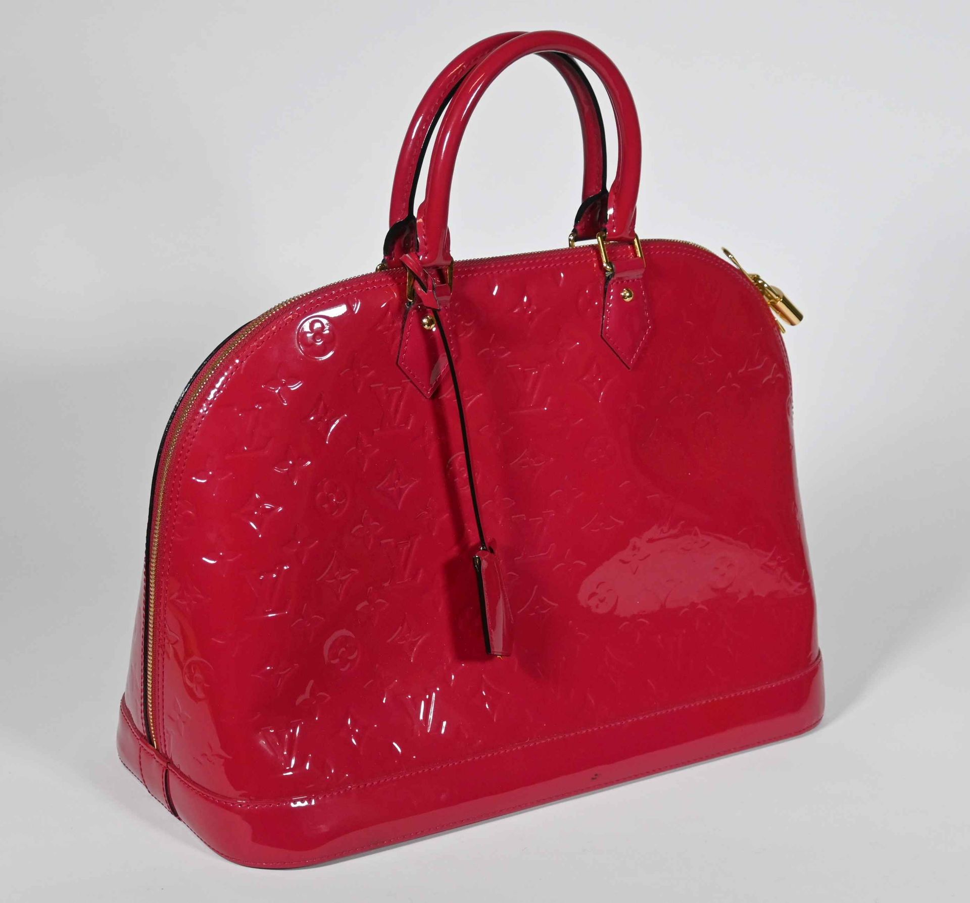 Louis Vuitton Alma handbag in red patent leather, mono…