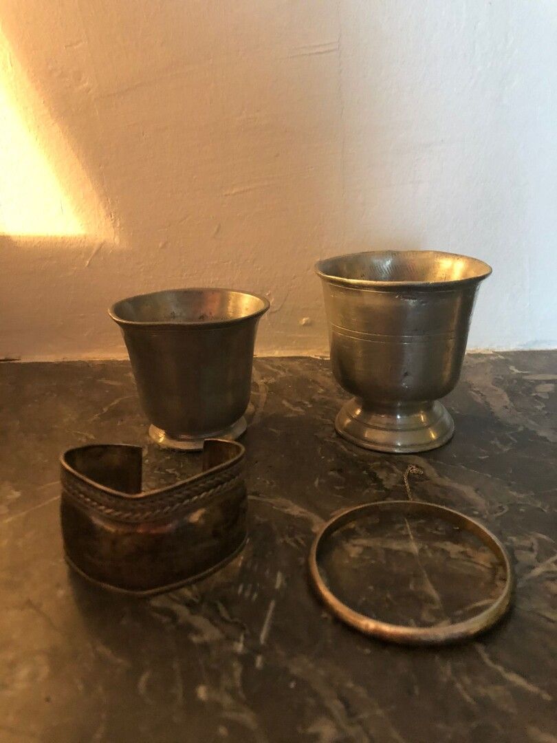 Null Lot including:

Two pewter cups and two silver bracelets