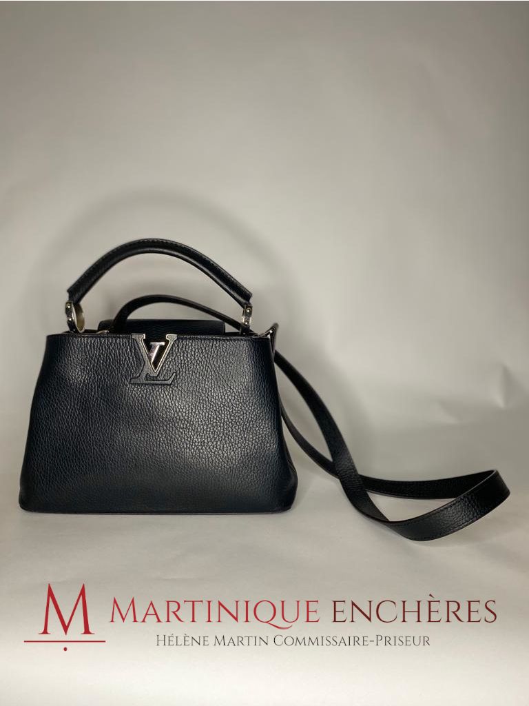LOUIS VUITTON Capucines model. Handbag in black grained…