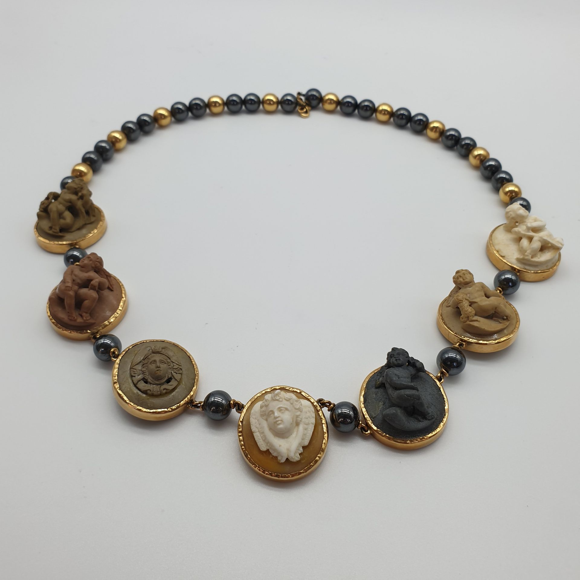 Null NECKLACE in yellow gold 750° and hematites decorated with seven medallions &hellip;