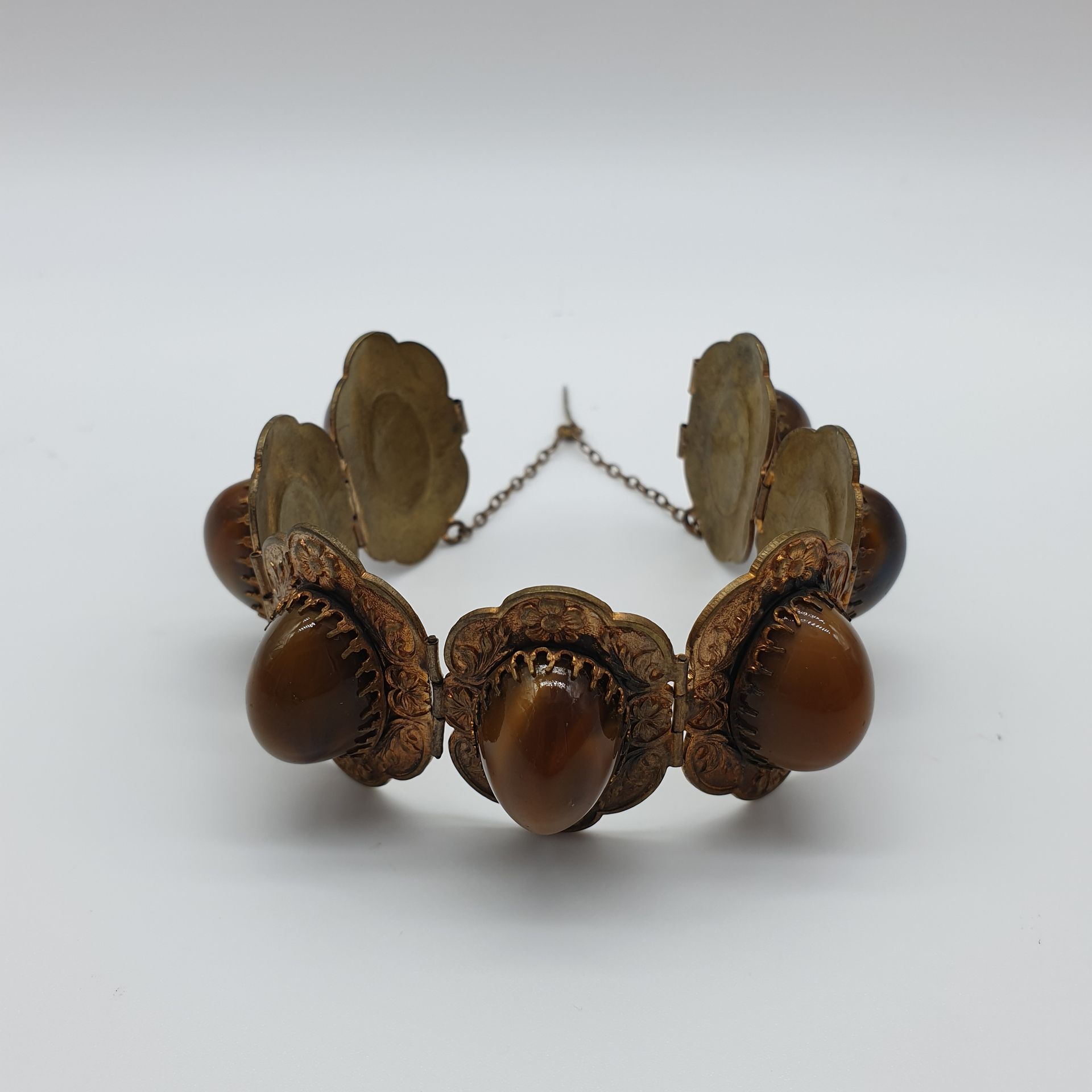Null BRACELET in vermeil metal decorated with seven cabochons like tiger's eye