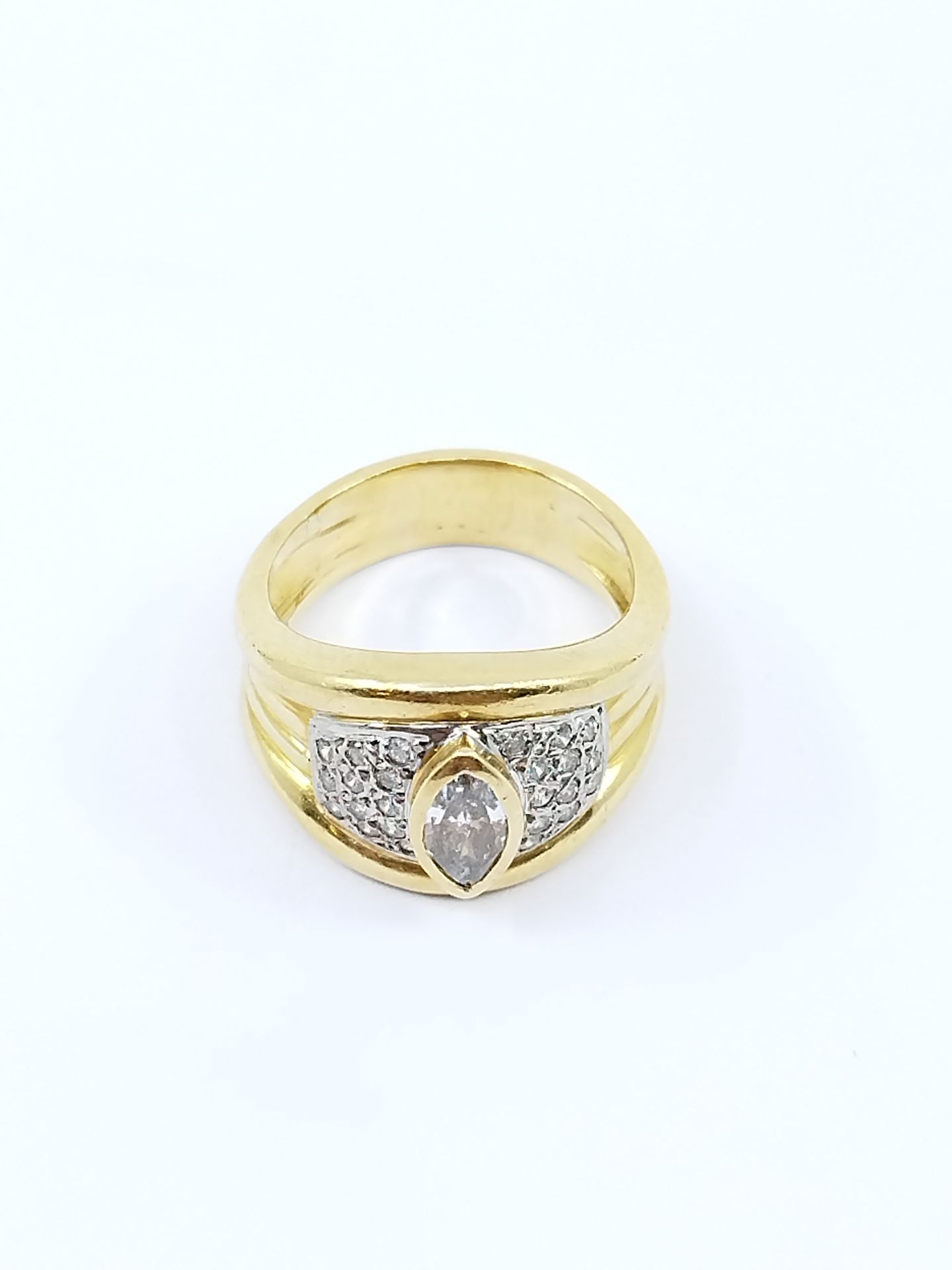 Null Ring in two-tone gold with a navette diamond in a closed setting with diamo&hellip;