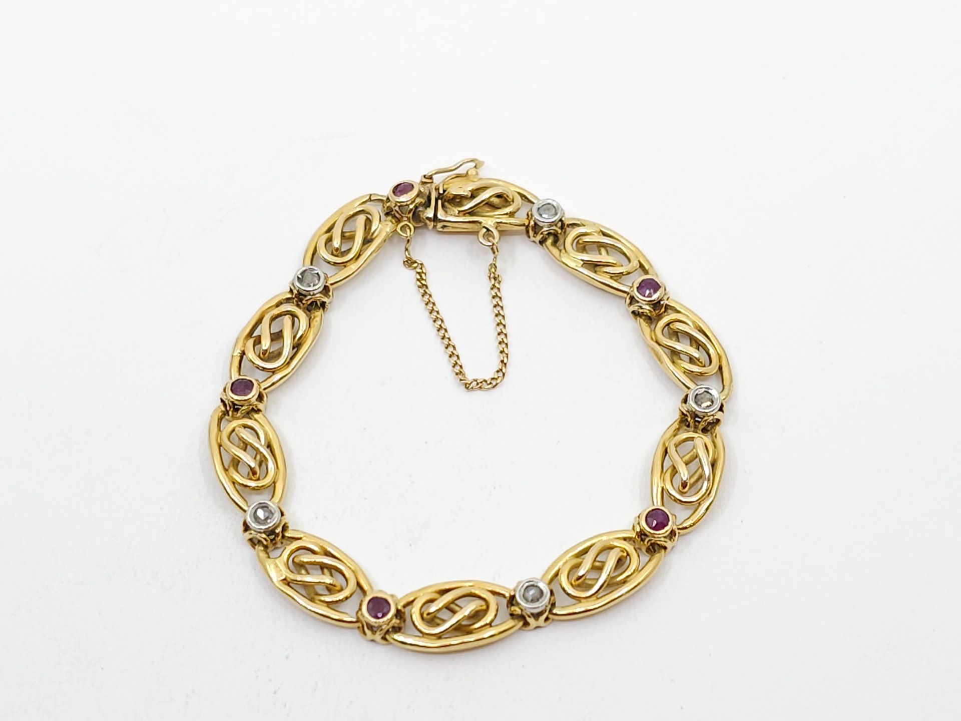 Null BRACELET in yellow gold 750° with oval openwork stitch dotted with diamonds&hellip;
