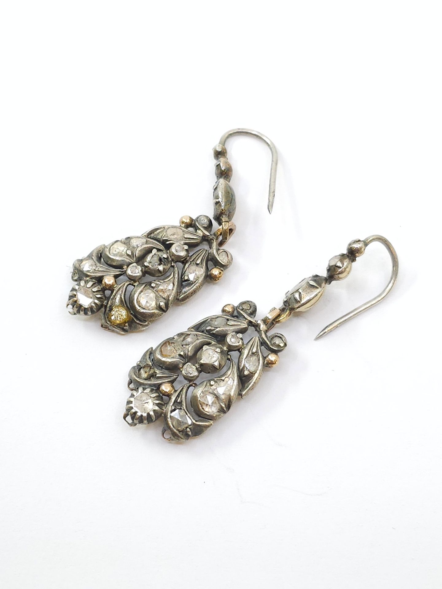 Null Pair of gold and silver girandole earrings set with roses 
Gross weight: 13&hellip;