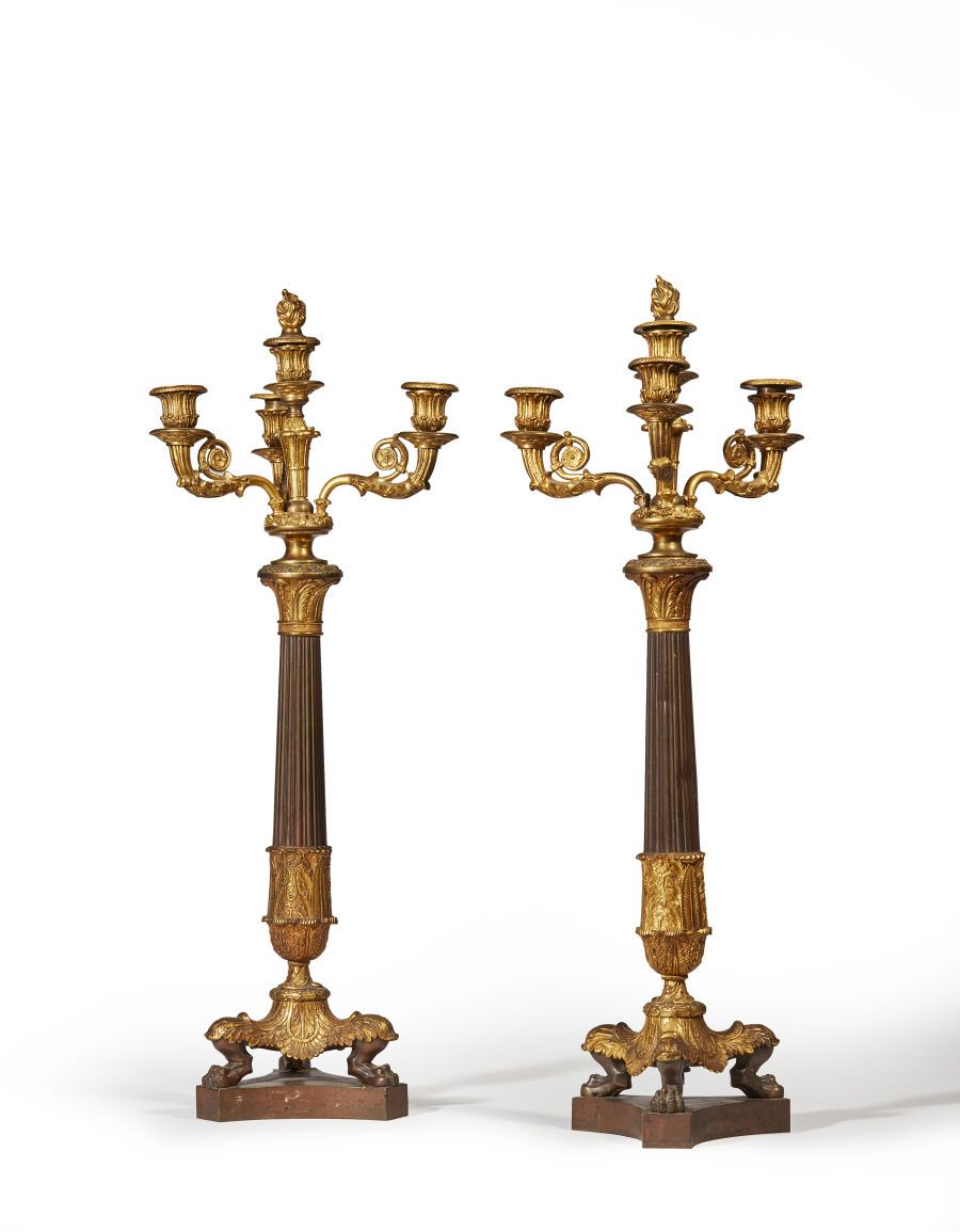 Null A pair of four-light patinated and gilt bronze torches, decorated with palm&hellip;