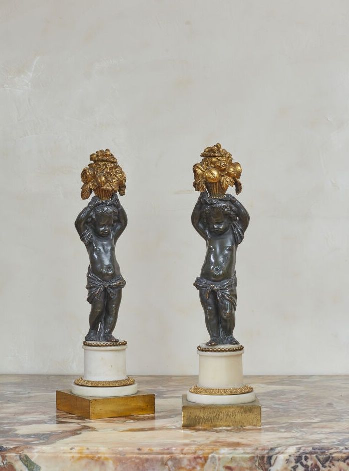 Null Pair of ormolu and brown patina bronze torches decorated with a putto suppo&hellip;