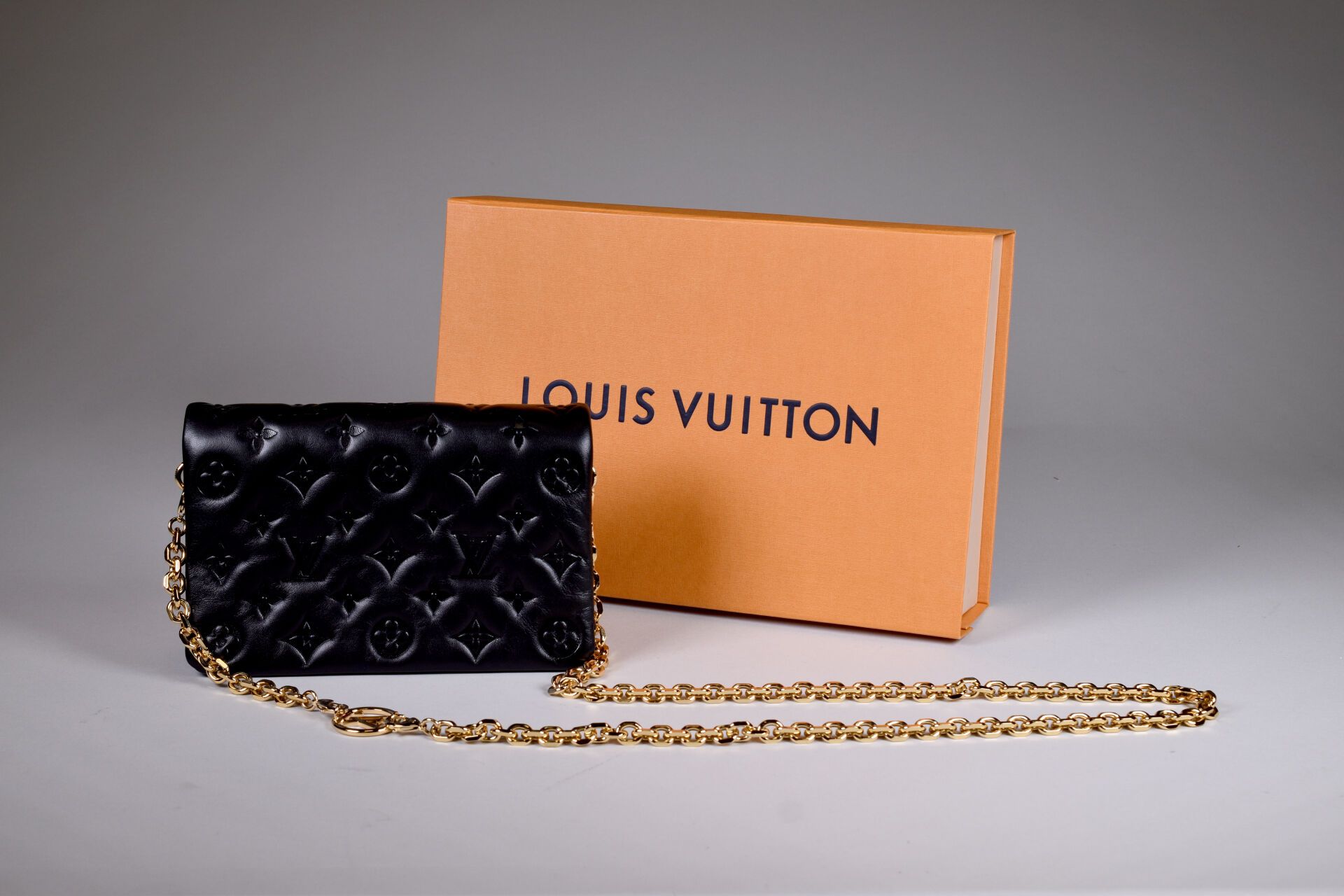 Null LOUIS VUITTON. Small "coussin" or "flap" bag in black monogrammed leather. &hellip;