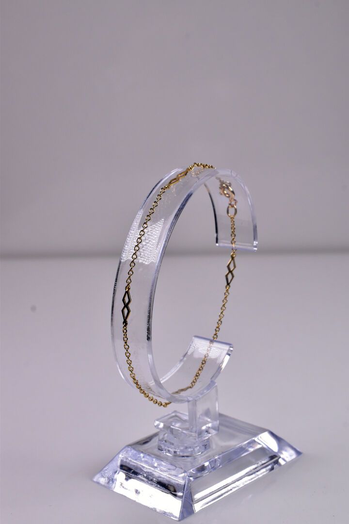 Null Fin bracelet en or jaune 18K 750/1000e à motif de losanges. Long. : 18 cm. &hellip;