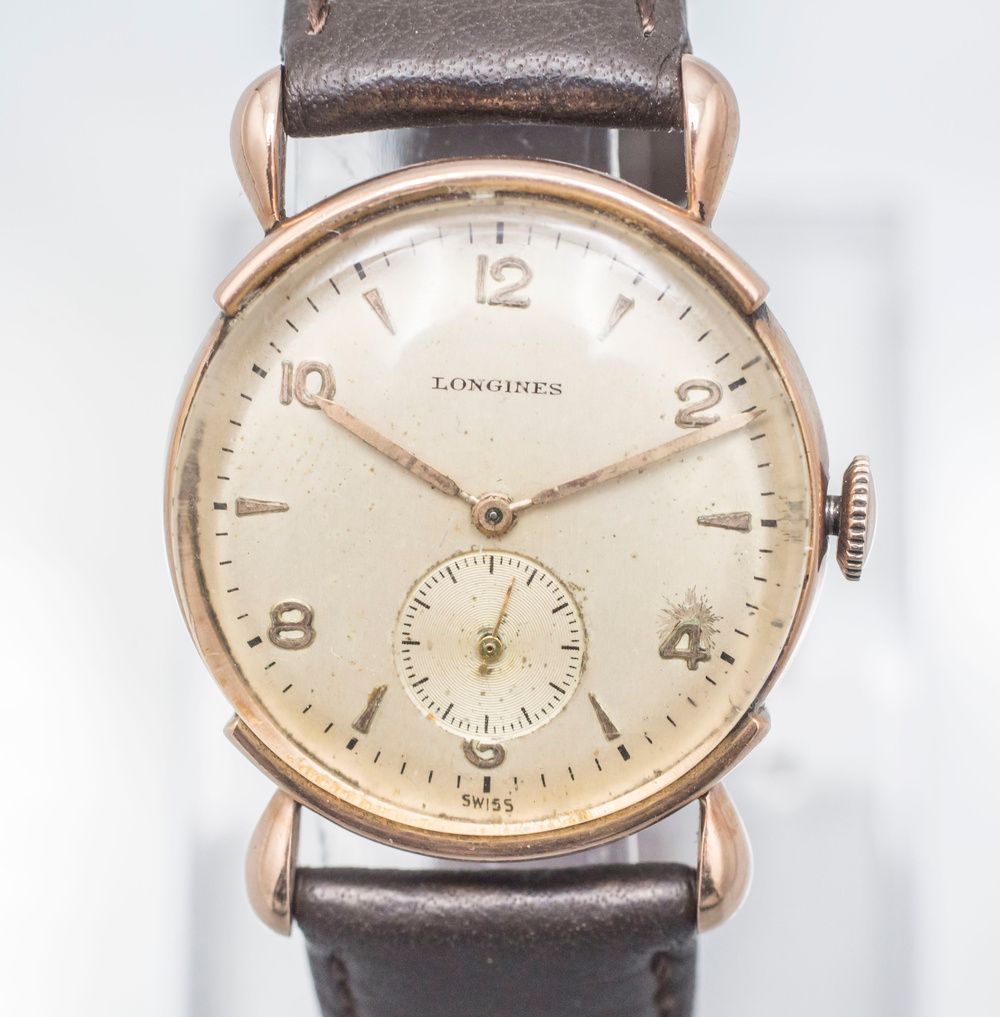 Gold Armbanduhr / A 14 ct gold wrist watch, Longines, Swiss/USA, um 1948 Case: G&hellip;