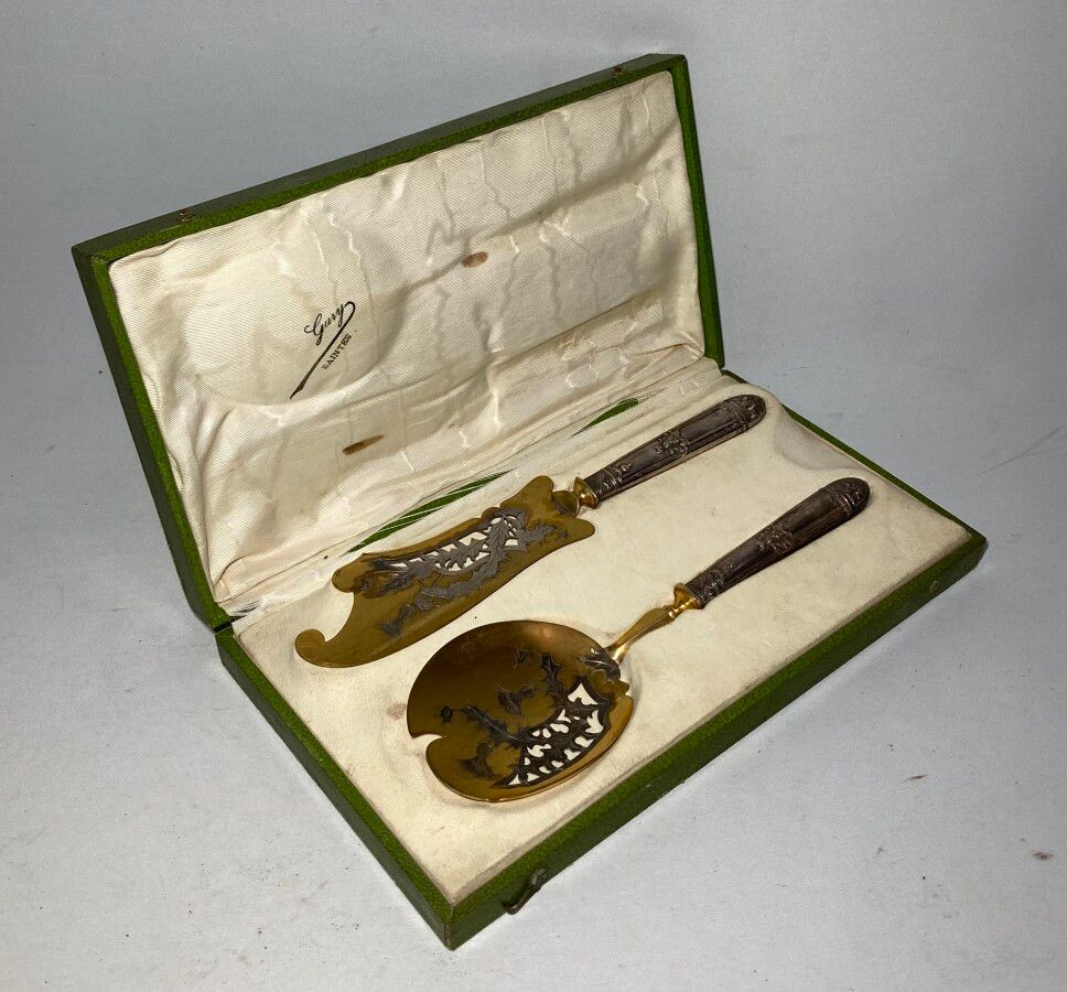 Null Silver and gilt metal ice service cover

L.: 25.5 cm (in its original box)
