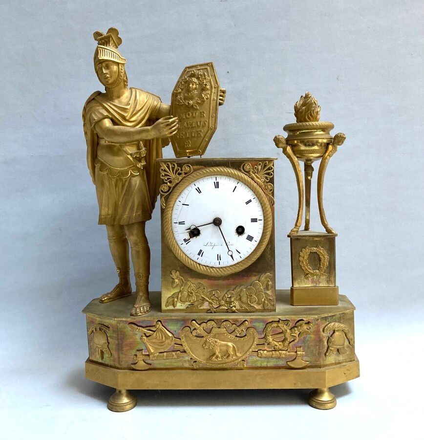Null Gilt bronze CLOCK featuring a helmeted man holding a roundel annotated "Lov&hellip;